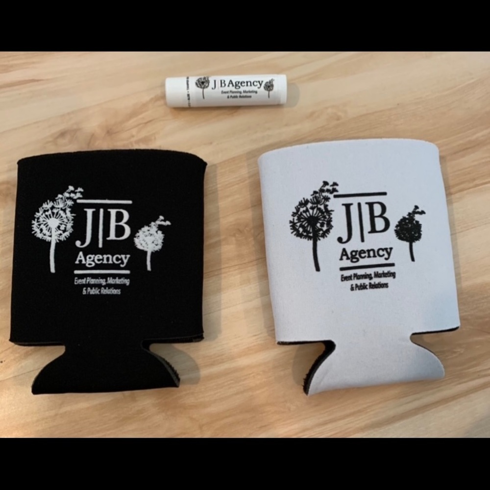 JB Agency Event planning NEW black & white coosie and NEW, unused chapstick!